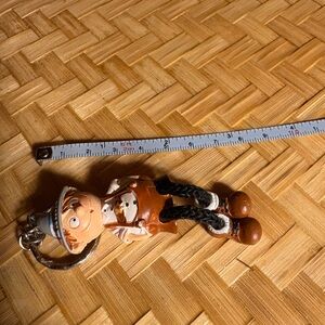 Brown and White Keychain Figure